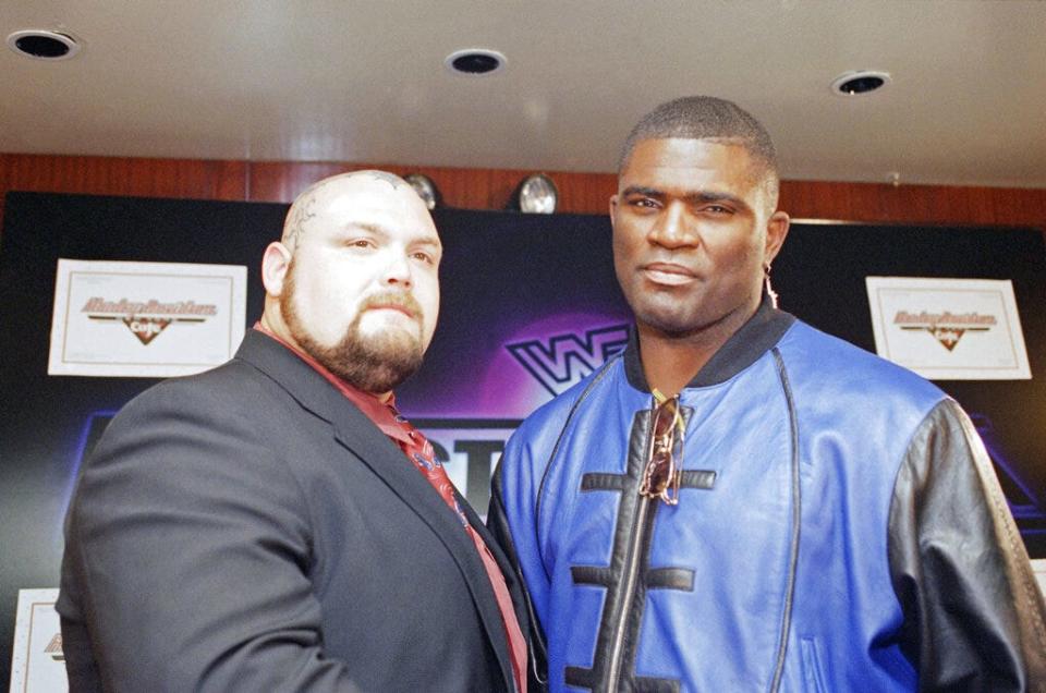 Former New York Giants linebacker Lawrence Taylor, right, poses with professional wrestler Bam Bam Bigelow during a news conference Tuesday, Feb. 28, 1995. Taylor, to the delight of some former teammates and the disbelief of many others, signed with the World Wrestling Federation to battle the 390-pound Bigelow in the feature match at Wrestlemania XI, which took place that April in Hartford, Conn.