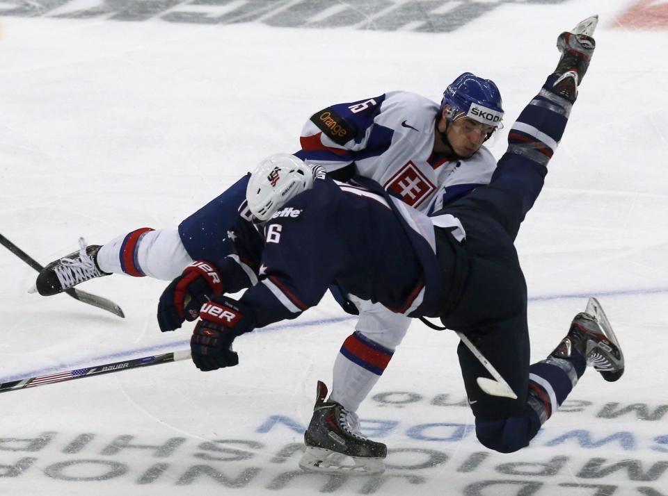 Slovakia's Lunter checks Santini of the U.S during their IIHF World Junior Championship ice hockey game in Malmo