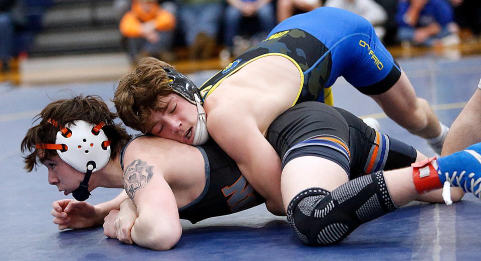 Ontario’s Jacob Ohl wrestles Galion’s Carter Trukovich during their 113 lbs match at the Division II District wrestling championships Saturday, March 2, 2024 at Norwalk High School. TOM E. PUSKAR/MANSFIELD NEWS JOURNAL
