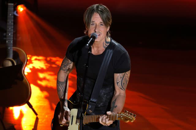 <p>Tibrina Hobson/Getty</p> Keith Urban performs at the ACM Honors on Aug. 21, 2024 in Nashville