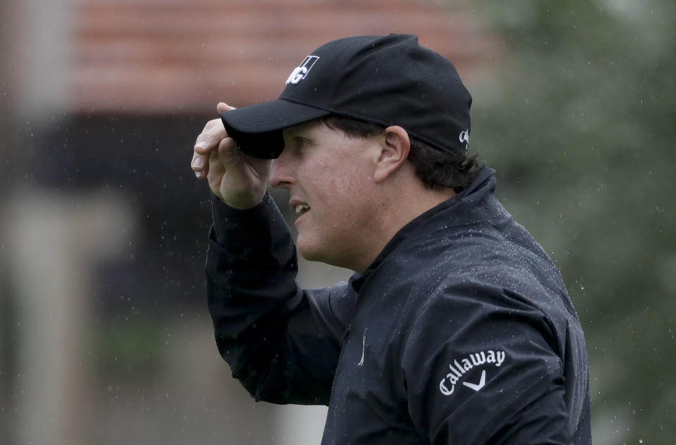 Phil Mickelson reacts after making a putt on the third hole during the first round of the CareerBuilder Challenge at the La Quinta County Club Thursday, Jan. 19, 2017 in La Quinta, Calif. (AP Photo/Chris Carlson)