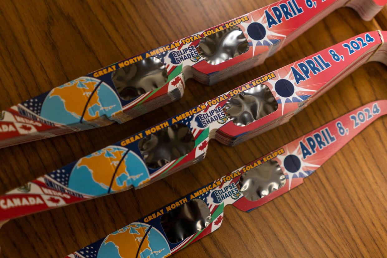 Glasses for viewing the upcoming solar eclipse sit on a desk at Wayne State University department of physics and astronomy professor and chair Ed Cackett's office at the Detroit campus on Friday, March 22, 2024.