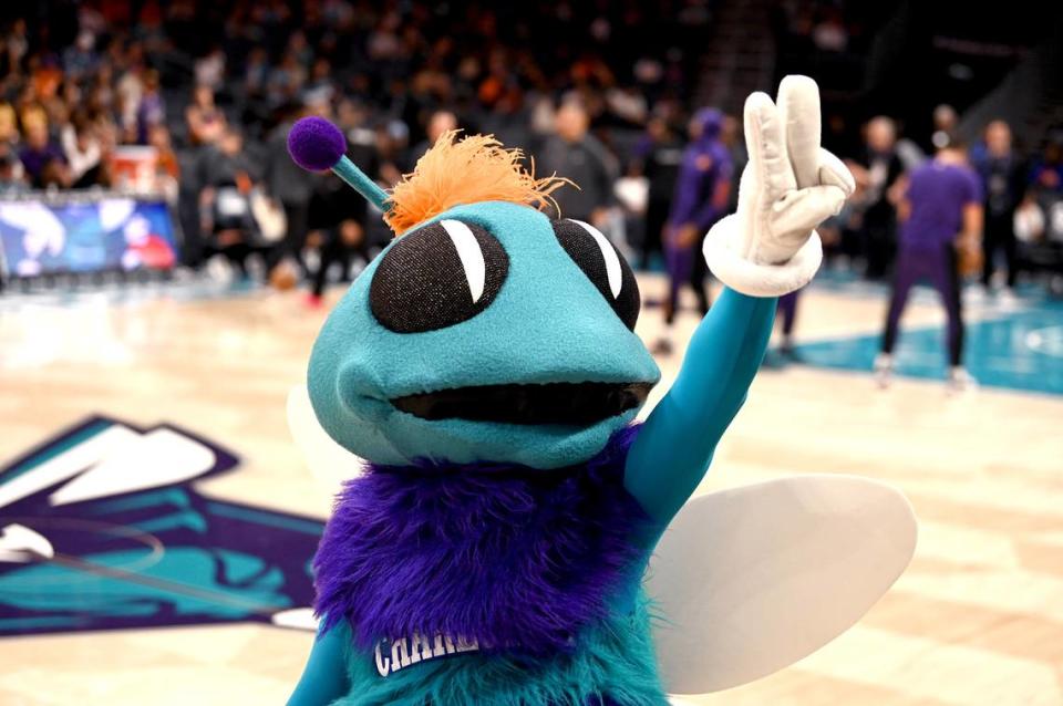 Charlotte Hornets mascot Hugo motions to the fans as he walks along the court at Spectrum Center in Charlotte, NC on Friday, March 15, 2024. The Hornets hosted the Suns in NBA action.