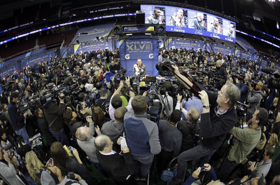 Denver Broncos' Peyton Manning answers questions during media day for the NFL Super Bowl XLVIII football game Tuesday, Jan. 28, 2014, in Newark, N.J. (AP Photo/Jeff Roberson)