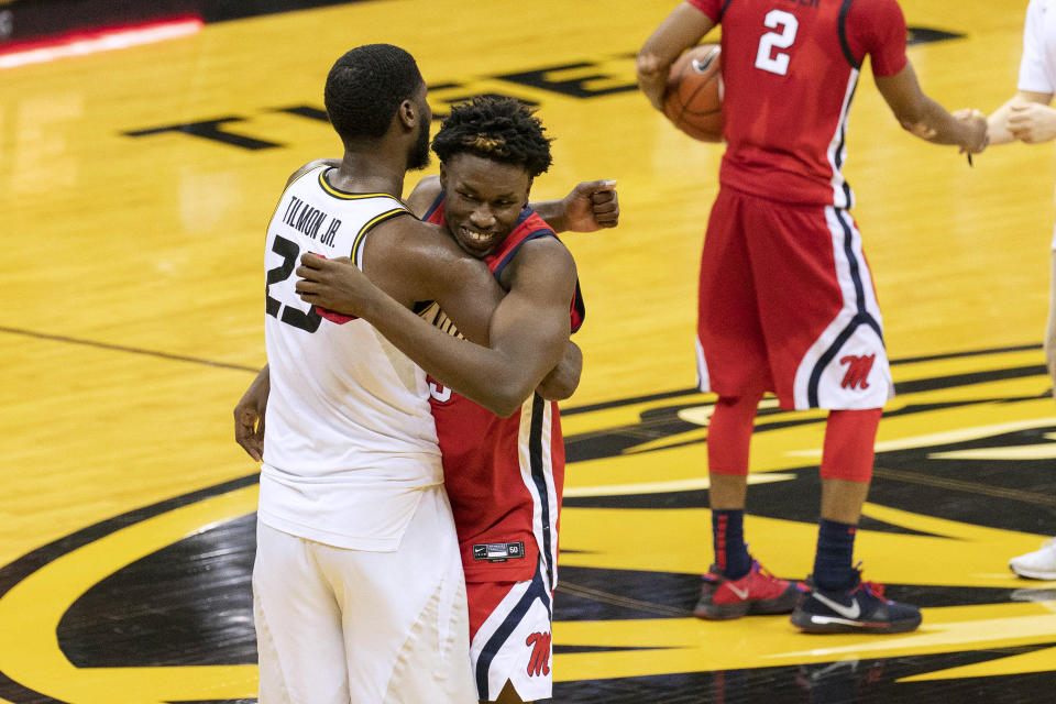 Missouri's Jeremiah Tilmon, left, and Mississippi's Sammy Hunter, right, embrace after Mississippi won the NCAA college basketball game Tuesday, Feb. 23, 2021, in Columbia, Mo. (AP Photo/L.G. Patterson)