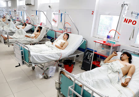 Afghan men who were injured in a recent attack in Kabul and Ghazni province, receive treatment at a hospital in Kabul, Afghanistan August 18, 2018. REUTERS/Mohammad Ismail