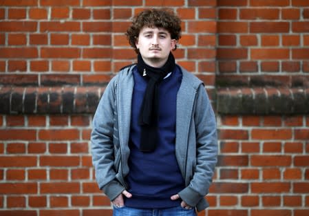 Mateo, 22, who voted in the primary elections, poses in Buenos Aires