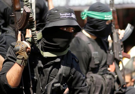 FILE PHOTO: Palestinian members of Hamas' armed wing take part in the funeral of senior militant Mazen Fuqaha in Gaza City March 25, 2017. REUTERS/Mohammed Salem/File Photo