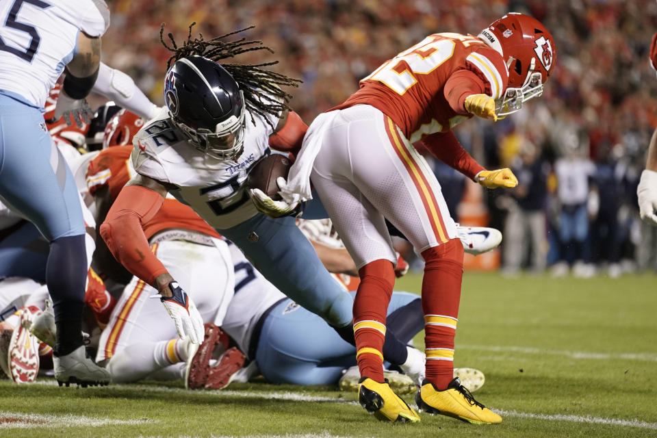 Tennessee Titans running back Derrick Henry scores past Kansas City Chiefs safety Juan Thornhill, right, during the first half of an NFL football game Sunday, Nov. 6, 2022, in Kansas City, Mo. (AP Photo/Ed Zurga)