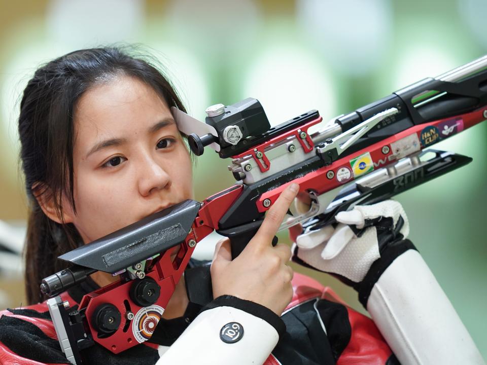 Chinese air rifle Olympic competitor Wang Luyao with air rifle gun