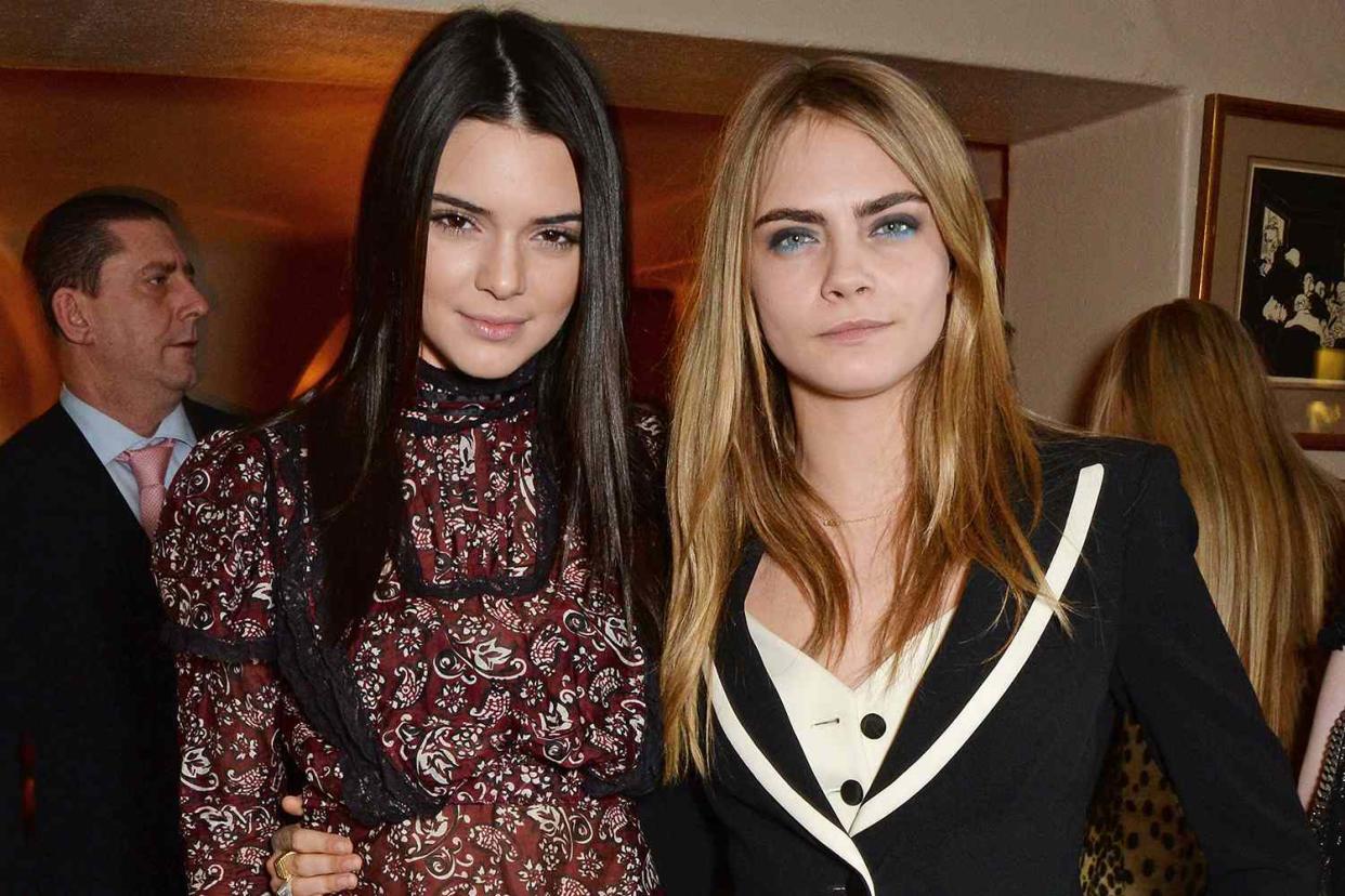 <p>David M. Benett/Getty Images</p> Kendall Jenner and Cara Delevingne in 2014.
