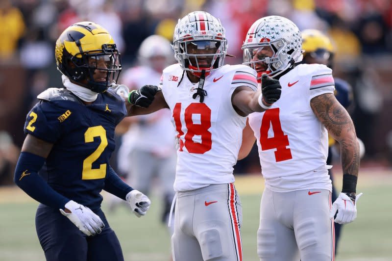 Wide receiver Marvin Harrison Jr. (C) helped the Ohio State Buckeyes clinch a spot in the 2023 Cotton Bowl Classic. File Photo by Aaron Josefczyk/UPI