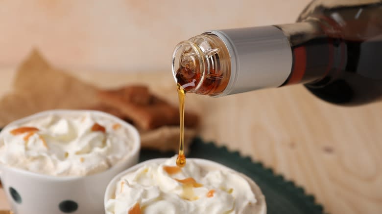 syrup pouring on whipped cream