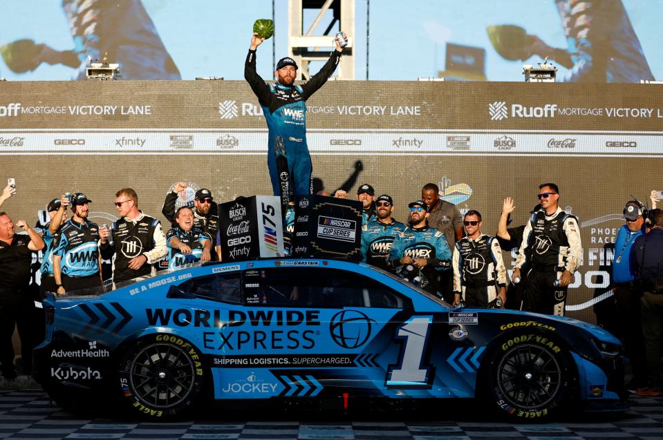 AVONDALE, ARIZONA - NOVEMBER 05: Ross Chastain, driver of the #1 Worldwide Express Chevrolet, celebrates in victory lane after winning the NASCAR Cup Series Championship race at Phoenix Raceway on November 05, 2023 in Avondale, Arizona. (Photo by James Gilbert/Getty Images)