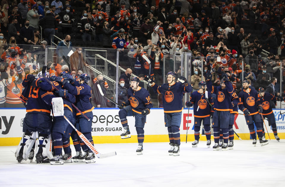 Edmonton Oilers celebrate the shootout win over the Nashville Predators after an NHL hockey game, Thursday, Jan. 27, 2022 in Edmonton, Alberta. (Jason Franson/The Canadian Press via AP)