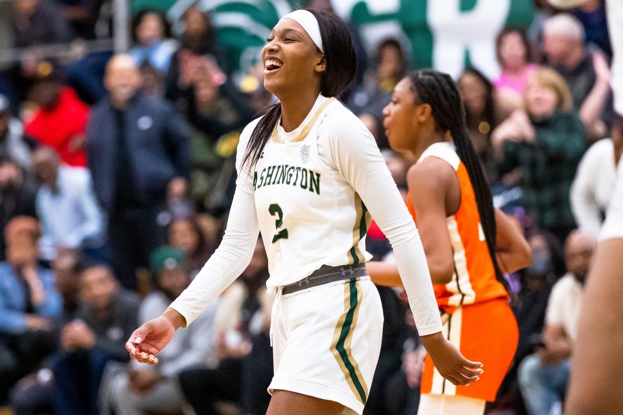 Washington's Rashunda Jones (2) smiles as she comes off the court for a timeout during the Washington vs. Fort Wayne Northrop girls basketball game Wednesday, Jan. 18, 2023 at Washington High School.