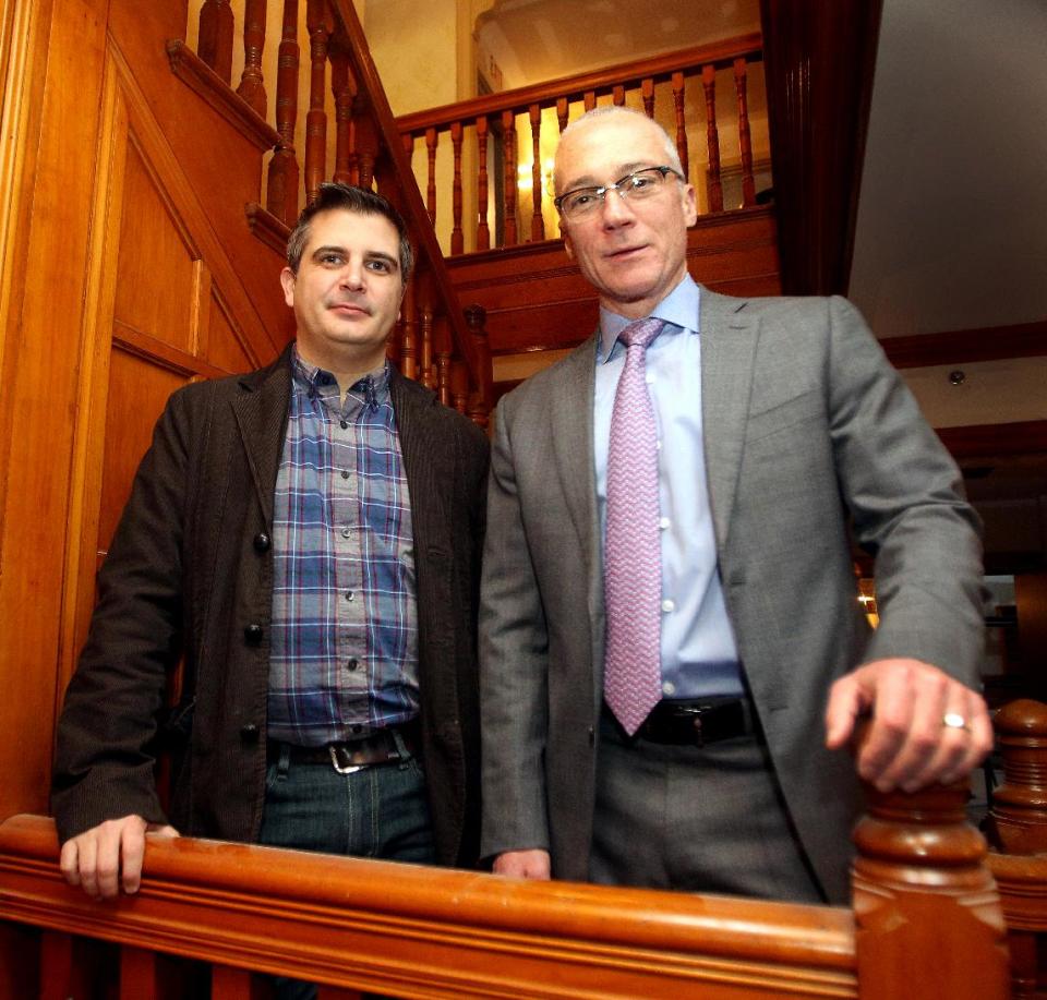 In this Jan. 13, 2014 photo, New Hampshire Republican Congressional candidate Dan Innis, right, poses with his partner Doug Palardy, in Portsmouth, N.H. The GOP’s formal platform, as set in its 2012 national convention, declares that “marriage, the union of one man and one woman, must be upheld as the national standard.” Republican opposition to gay marriage has become less visible recently, however, as the GOP works to improve its image and polling suggests that most Americans support same-sex marriage. (AP Photo/Jim Cole)