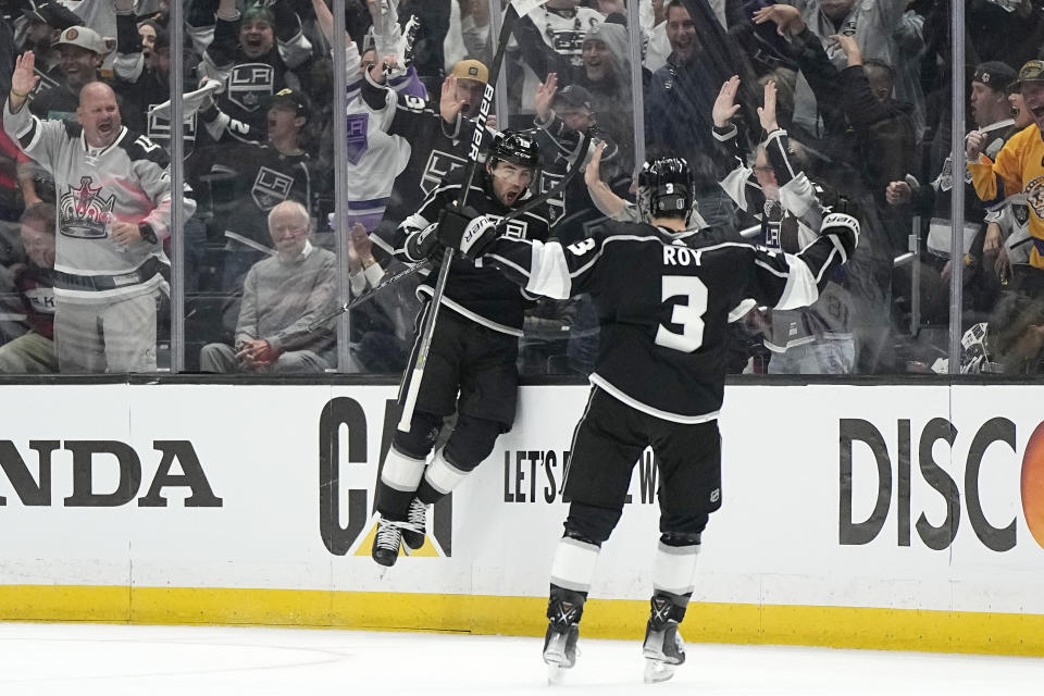 Los Angeles Kings left wing Alex Iafallo, left, celebrates his goal with defenseman Matt Roy during the first period in Game 3 of an NHL hockey Stanley Cup first-round playoff series against the Edmonton Oilers Friday, April 21, 2023, in Los Angeles. (AP Photo/Mark J. Terrill)