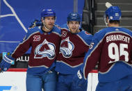 Colorado Avalanche left wing Brandon Saad, left, celebrates scoring a goal with defenseman Devon Toews and left wing Andre Burakovsky in the first period of an NHL hockey game against the Arizona Coyotes Wednesday, March 10, 2021, in Denver. (AP Photo/David Zalubowski)