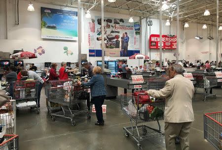 People are seen inside shopping at a Costco Wholesale warehouse club in Westbury, New York, U.S., May 23, 2016. REUTERS/Shannon Stapleton - RTSFV3F