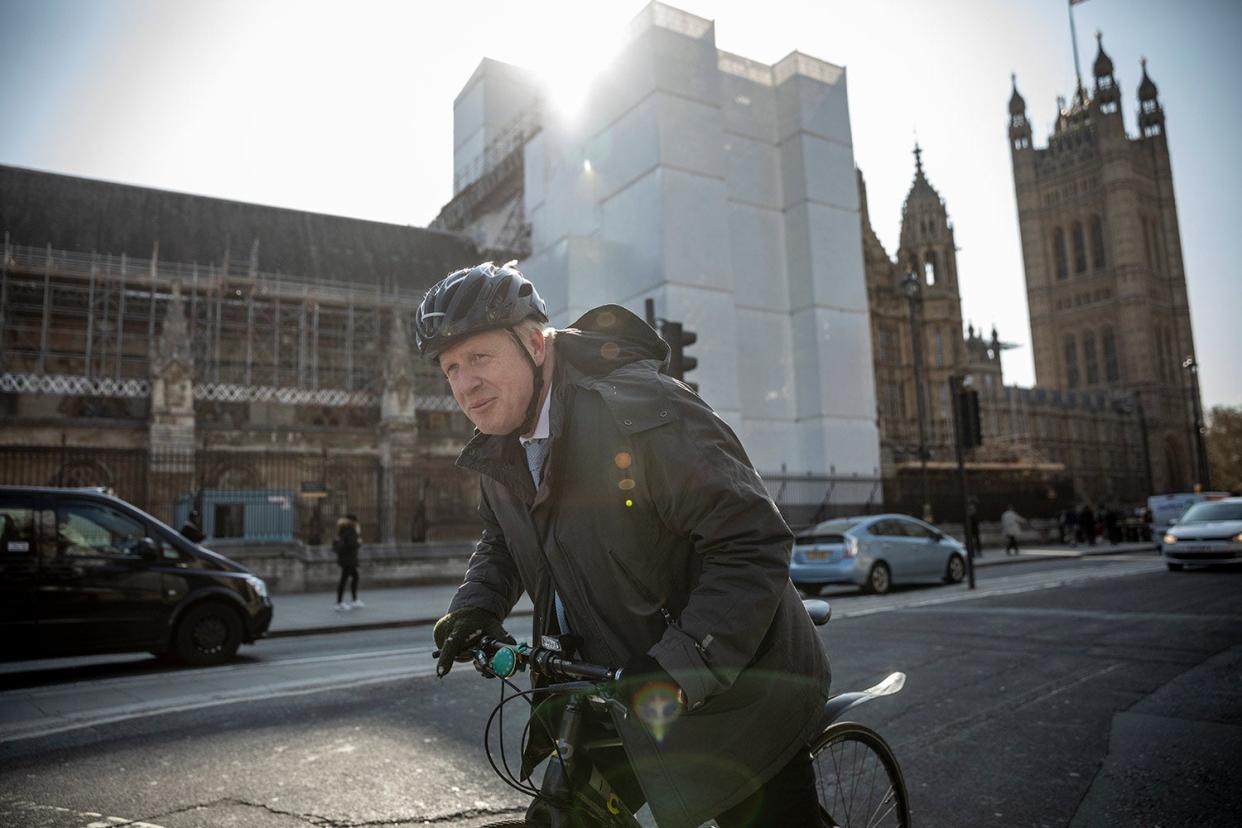 <p>File image of Boris Johnson cycling in Westminster in April 2019 </p> (Getty Images)