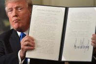 <p>DEC. 6, 2017 – President Donald Trump holds up a signed proclamation after he delivered a statement on Jerusalem from the Diplomatic Reception Room of the White House in Washington, DC.<br> President Donald Trump recognized the disputed city of Jerusalem as Israel’s capital — a historic decision that overturns decades of US policy and risks triggering a fresh spasm of violence in the Middle East.”I have determined that it is time to officially recognize Jerusalem as the capital of Israel,” Trump said from the White House.”It’s the right thing to do.” (Photo: Mandel Ngan/AFP/Getty Images) </p>