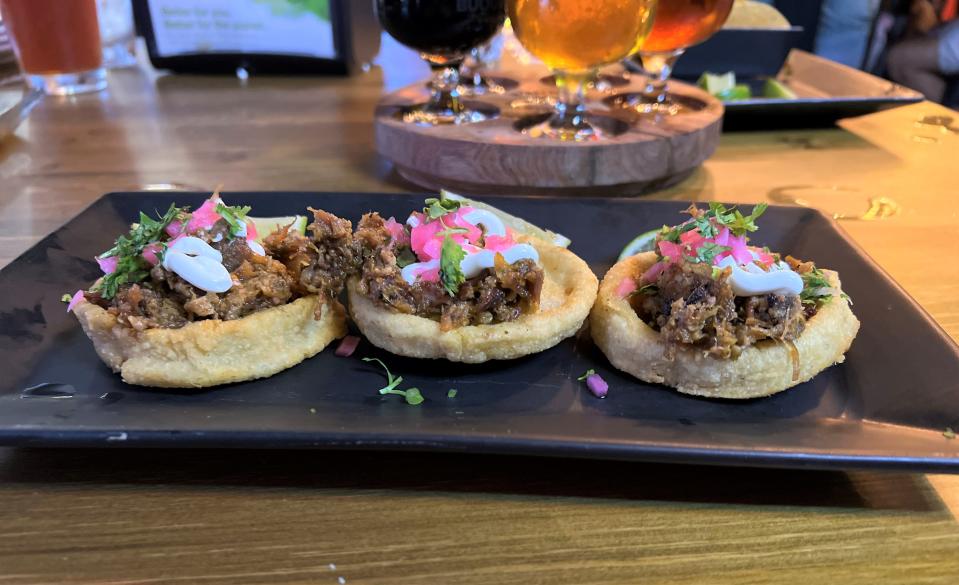 Sopes de chicharron arrived in a set of three.