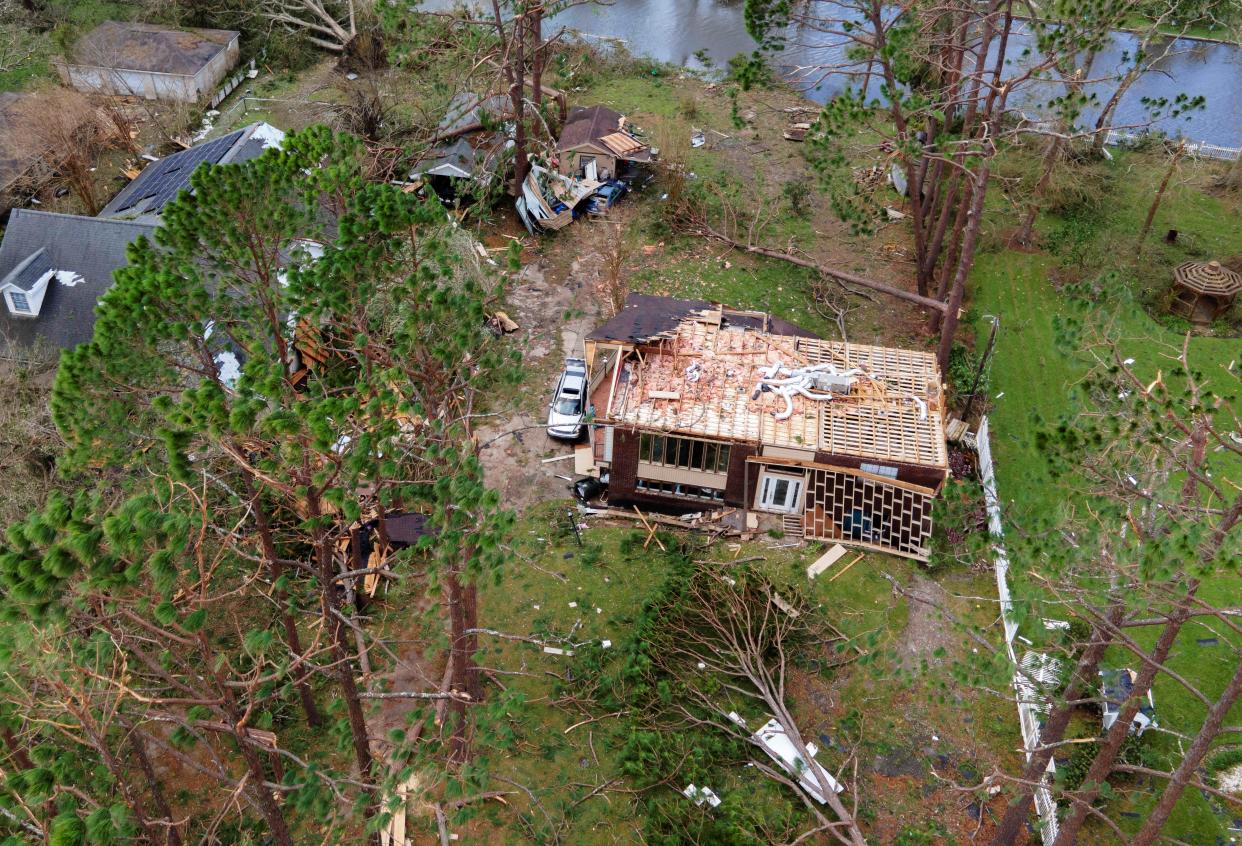 A house with no roof is seen after Hurricane Ida hit Houma, Louisiana, the United States, Aug. 30, 2021. With stranded people waiting for rescue on damaged roofs, flooded roads blocked by downed trees and power lines, and over one million people without power through Monday morning, Hurricane Ida has wreaked widespread havoc since its landfall in southern U.S. state of Louisiana on Sunday. (Nick Wagner/Xinhua via Getty Images)