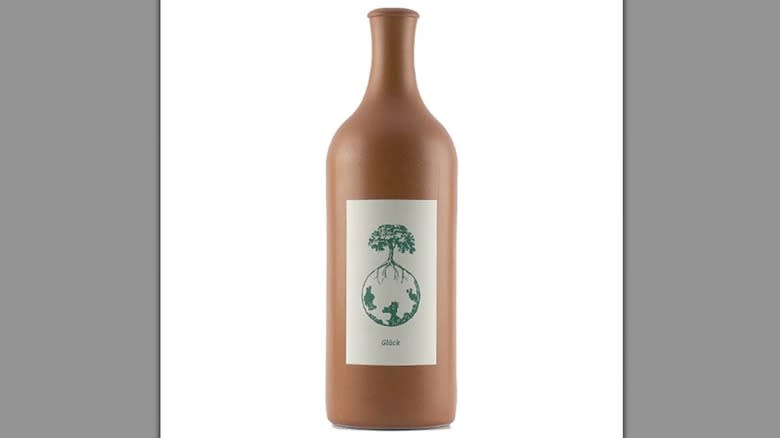 terracotta wine bottle on white