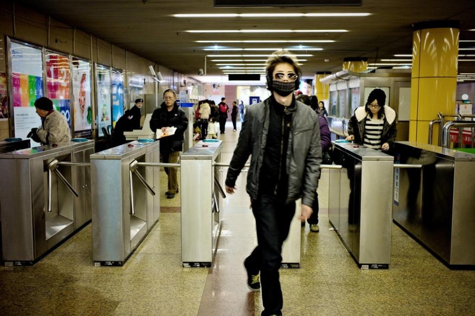 Passengers enter a metro station in Shanghai (AFP/Getty Images)