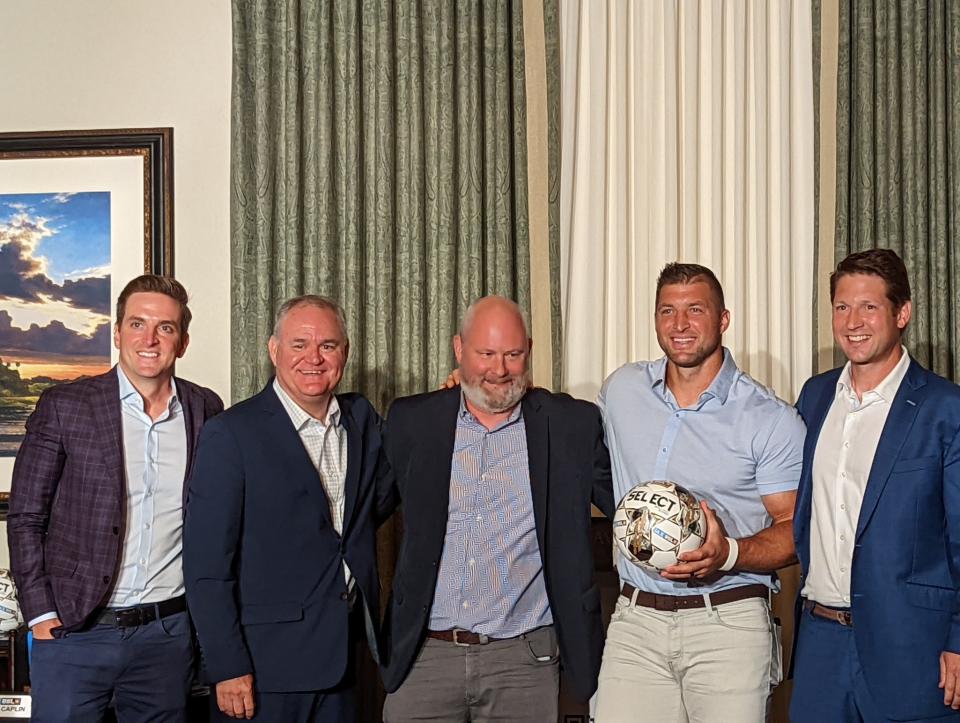 JAXUSL's ownership group (from left) of Jordan Graumann, Steve Livingstone, Tony Allegretti, Tim Tebow and Ricky Caplin gathers after a press conference to announce Jacksonville's United Soccer League franchise on August 30, 2022. [Clayton Freeman/Florida Times-Union]