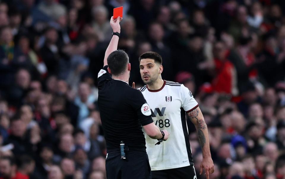 Aleksandar Mitrovic of Fulham receives a red card from Referee Chris Kavanagh during the Emirates FA Cup Quarter Final match between Manchester United and Fulham at Old Trafford - Getty Images/Clive Brunskill