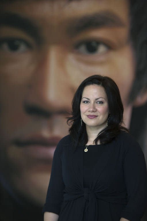 Shannon Lee, daughter of martial arts icon and actor Bruce Lee, poses for a photo during an interview with AFP, in Hong Kong, on July 18, 2013. Hailed as cinema's first martial arts hero and a cinematic bridge between the cultures of East and West, Lee helped put Hong Kong on the movie world map
