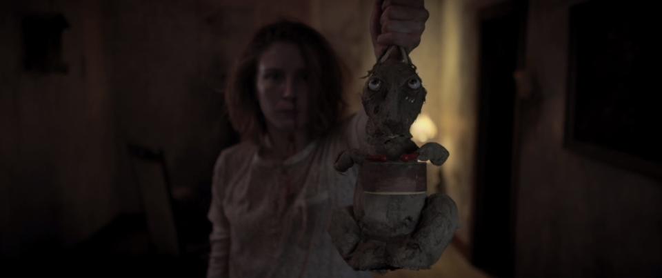 Olga (Leila Sykes) has a drum-playing toy rabbit that detects the supernatural in the horror movie "Caveat."