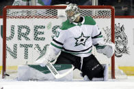 FILE - Dallas Stars goaltender Ben Bishop stops a shot on goal during the first period of an NHL hockey game against the New York Islanders in New York, in this Tuesday, Feb. 4, 2020, file photo. Bishop, who hasn't played any games after twice having knee surgery last year, will not play this season. Stars general manager Jim Nill said the move will allow Bishop time to continue his rehabilitation and return to full health for the start of 2021-22. (AP Photo/Frank Franklin II, File)