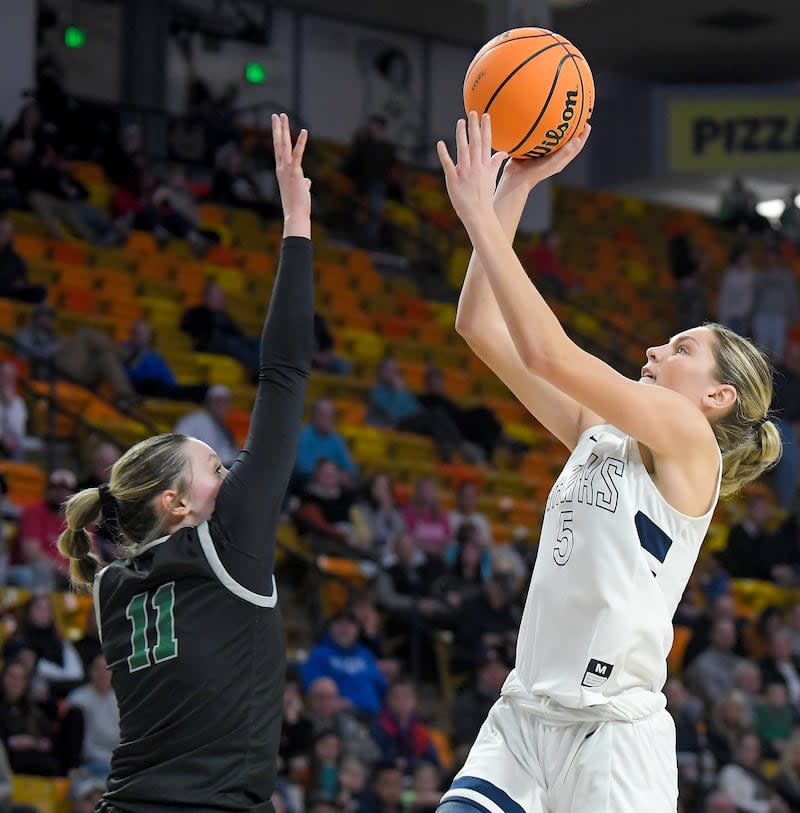 Ridgeline's Emilee Skinner shoots the ball as Green Canyon's Marissa Best defends during a semifinal game in the Utah 4A girls basketball tournament on Thursday in Logan. | Eli Lucero, Herald Journal