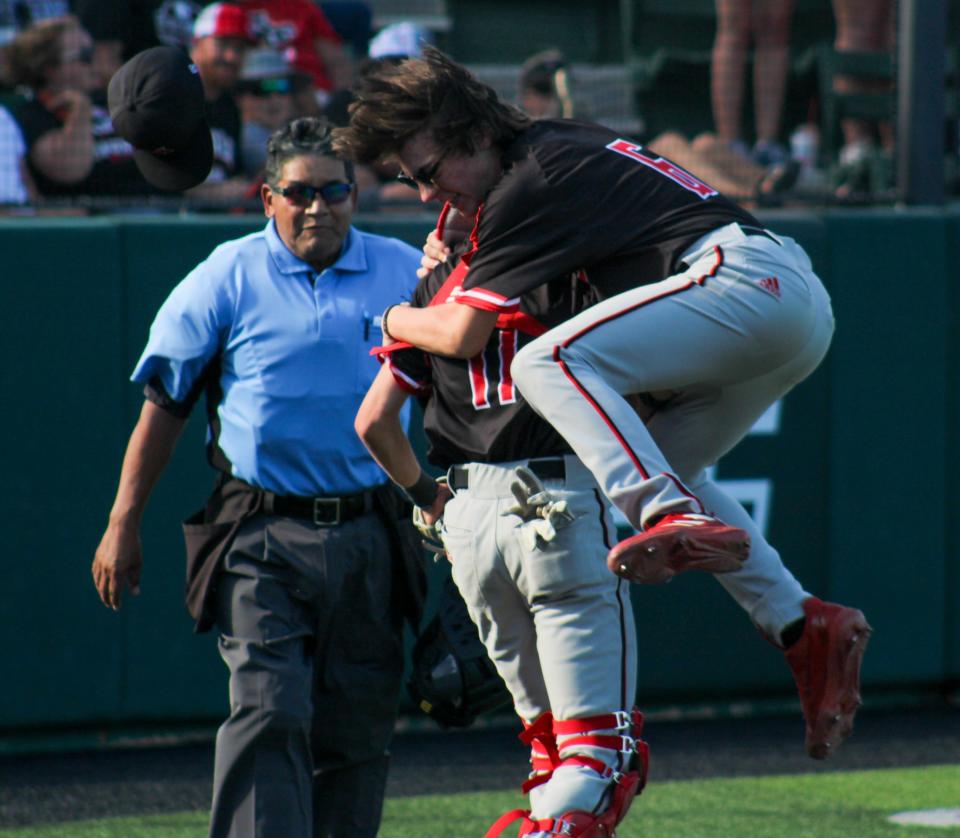 New Home's Brenden Beckham (6) hugs Ryan Bundy following the Region I-2A semifinal baseball series at Crutcher Scott Field at Abilene Christian University on Saturday, May 28, 2022.