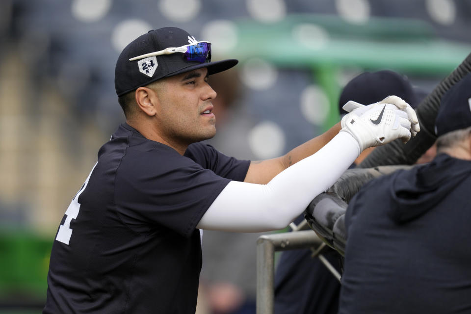 New York Yankees catcher Yoendrys Gomez waits to hit in the batting cage during a baseball spring training workout Thursday, Feb. 15, 2024, in Tampa, Fla. (AP Photo/Charlie Neibergall)