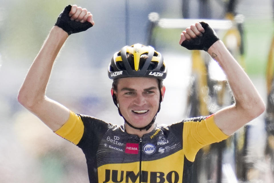 Sepp Kuss of the US celebrates as he crosses the finish line to win the fifteenth stage of the Tour de France cycling race over 191.3 kilometers (118.9 miles) with start in Ceret and finish in Andorra-la-Vella, Andorra, Sunday, July 11, 2021. (AP Photo/Christophe Ena)