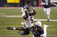 Arizona wide receiver BJ Casteel (5) can not make the catch in front of Northern Arizona defensive back Colby Humphrey during the first half of an NCAA college football game, Saturday, Sept. 18, 2021, in Tucson, Ariz. (AP Photo/Rick Scuteri)