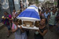 <p>Female family members of Erick Rivas, 20, who died in the hospital after suffering burns from the eruption of the Volcan de Fuego, which in Spanish means Volcano of Fire, carry his remains to the Catholic church to bury him in San Juan Alotenango, Guatemala, Wednesday, June 6, 2018. (Photo: Luis Soto/AP) </p>