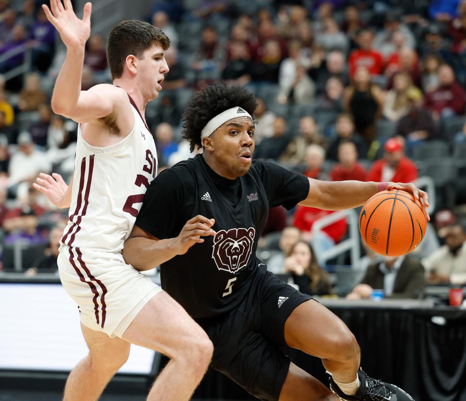 Missouri State's Donovan Clay (5) moves the ball during a Missouri Valley Conference Tournament game against Southern Illinois, Friday, March 3, 2023, at Enterprise Center in St. Louis. 