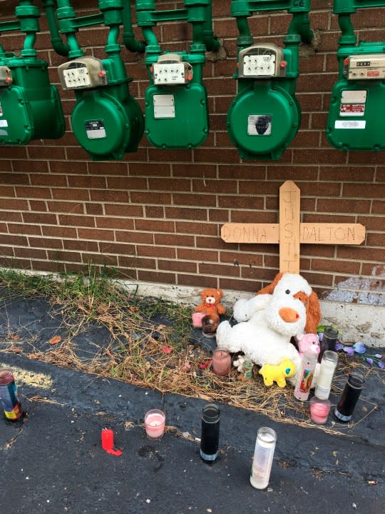 This Oct. 2, 2018, photo shows what is left of an impromptu memorial to the late Donna Castleberry near the scene of her August shooting death behind an apartment house in Columbus, Ohio. Castleberry’s familyis still waiting for more information about her death at the hands of an undercover Columbus police officer in the officer’s unmarked car in August. The FBI is investigating the agency’s vice squad after that incident and the July arrest of porn actress Stormy Daniels. (AP Photo/Andrew Welsh-Huggins)