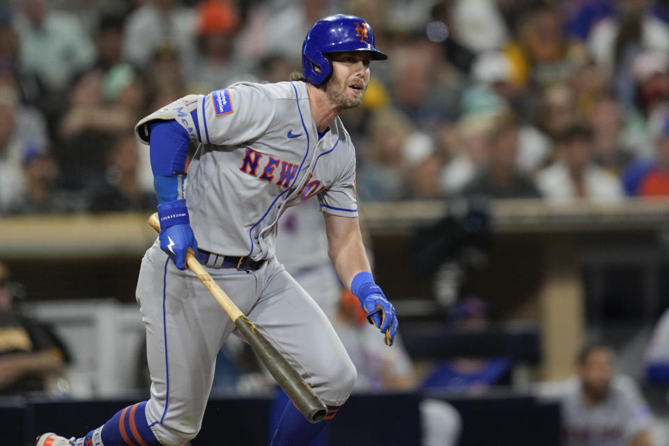 CORRECTS TO 10TH INNING, INSTEAD OF NINTH - New York Mets' Jeff McNeil watches his RBI double against the San Diego Padres during the 10th inning of a baseball game Friday, July 7, 2023, in San Diego. (AP Photo/Gregory Bull)