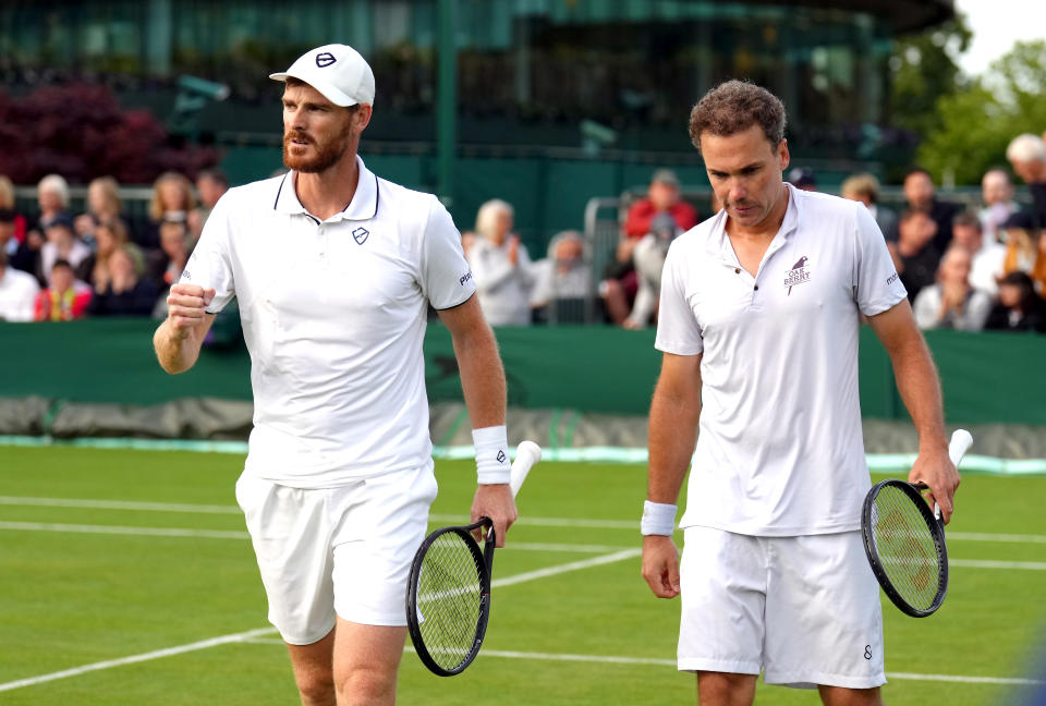 Great Britain's Jamie Murray (left) and partner Bruno Soares celebrate winning his first round men's doubles match at Wimbledon