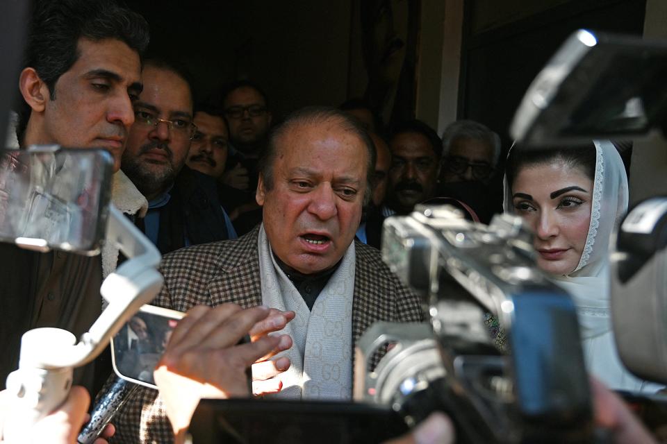 Pakistan’s former Prime Minister and leader of the Pakistan Muslim League-Nawaz (PML-N) Nawaz Sharif (C) along with his daughter Maryam Nawaz (R) speaks to media after casting his ballot in Lahore (AFP via Getty Images)