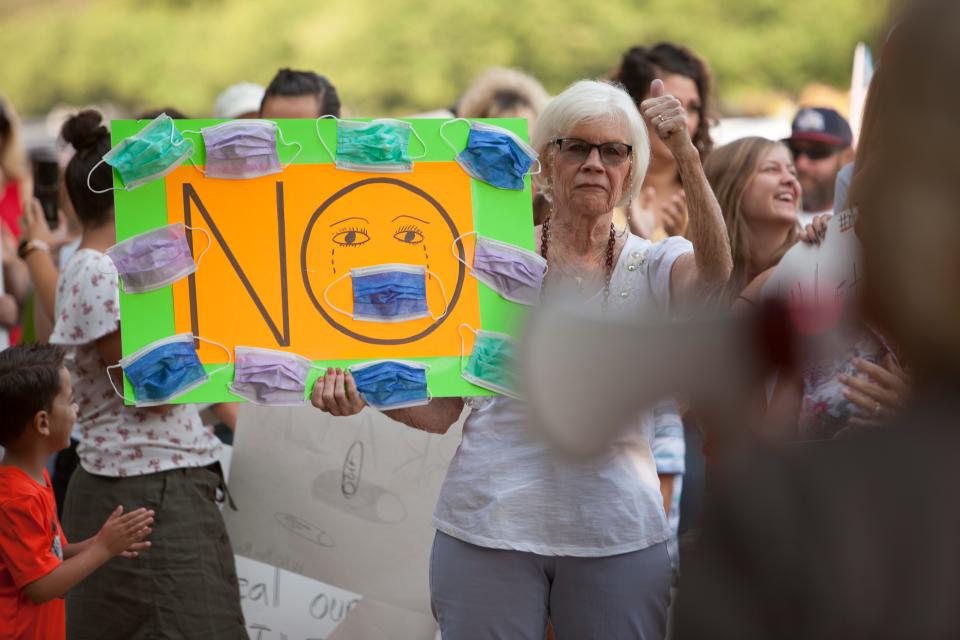 Members of the community gather at the Washington County School District office in St. George, Utah, to protest the use of masks in local schools on Aug. 21, 2020.