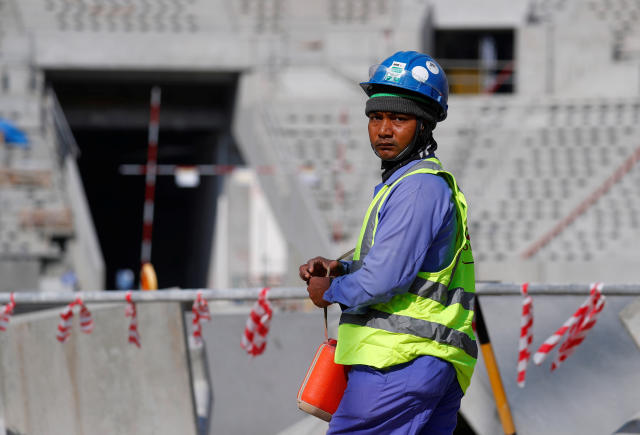 A worker is seen inside the Lusail stadium which is under construction for the upcoming 2022 Fifa soccer World Cup during a stadium tour in Doha, Qatar, December 20, 2019.  REUTERS/Kai Pfaffenbach