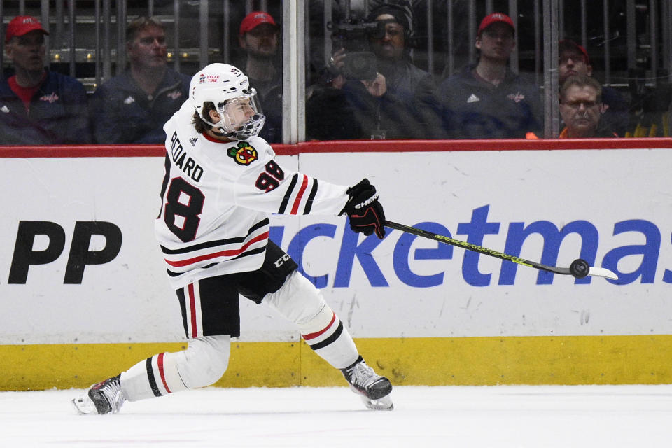 Chicago Blackhawks center Connor Bedard (98) shoots the puck during the first period of an NHL hockey game against the Washington Capitals, Saturday, March 9, 2024, in Washington. (AP Photo/Nick Wass)