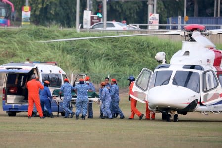 A body believed to be 15-year-old Irish girl Nora Anne Quoirin who went missing is brought out of a helicopter in Seremban.